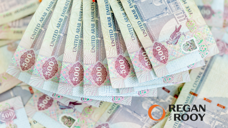 Banknotes fanned out on a table, illustrating crypto transfers treated as an outflow of capital